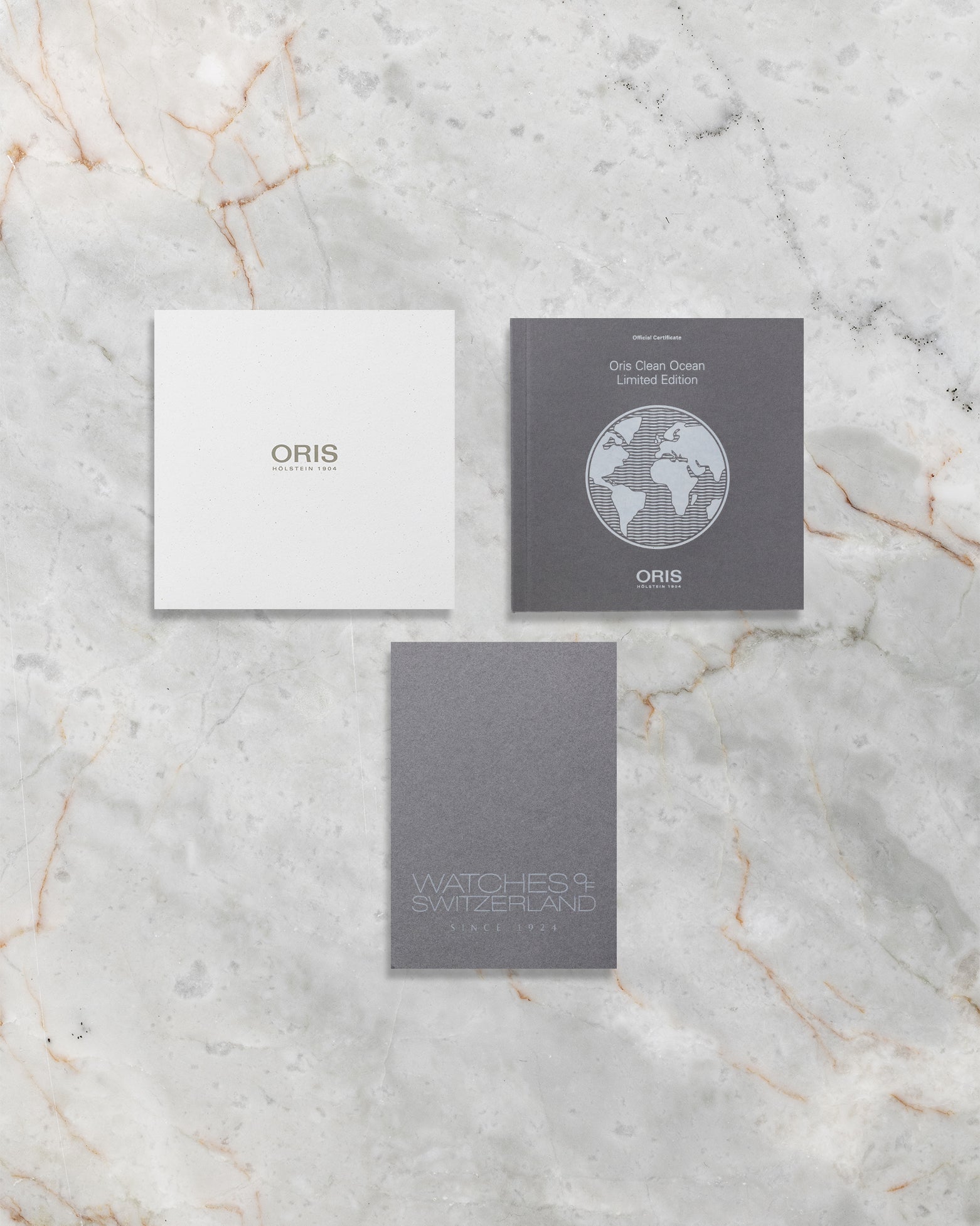 Original Oris instruction manuals and Clean Ocean Limited Edition certificate documentation accompanying the pre-owned 2022 model.
