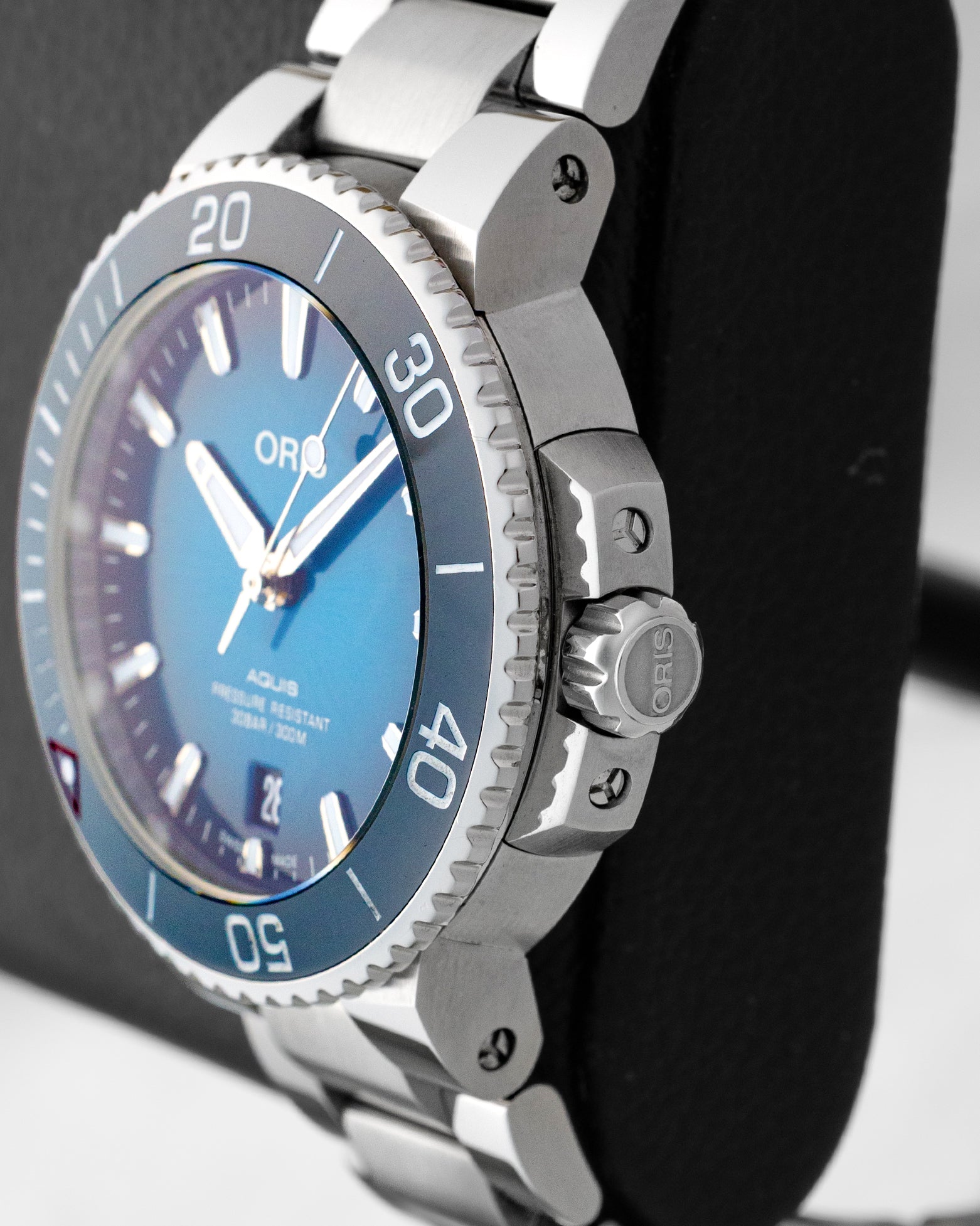Right side profile view of the pre-owned 2022 Oris Aquis Clean Ocean 01 733 7732 4185 stainless steel case, crown guards, and screwed-in crown.