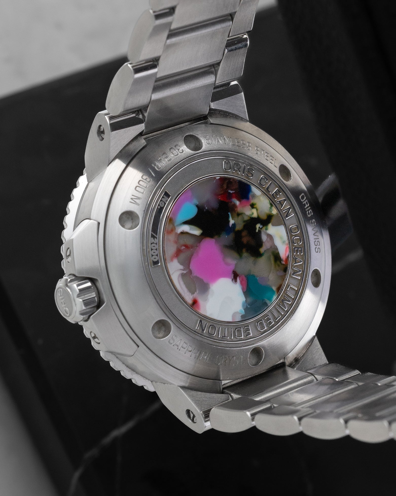 Close-up of the Oris Aquis Clean Ocean Limited Edition caseback featuring its unique medallion made from recycled PET ocean plastic.