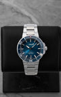 Pre-owned 2022 Oris Aquis Date Clean Ocean Limited Edition reference 01 733 7732 4185 featuring a sunburst aqua blue dial and blue ceramic bezel on display cushion.