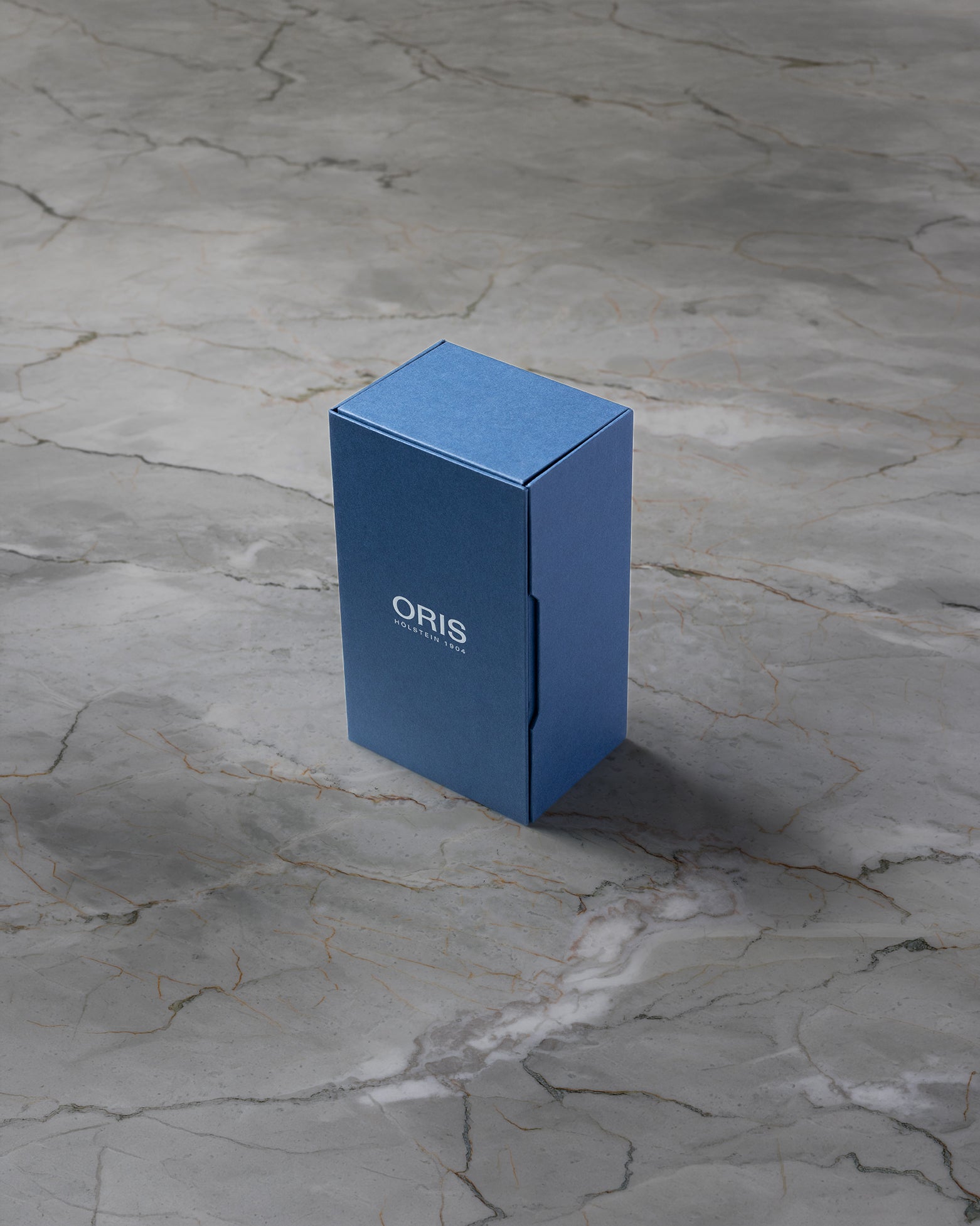 Original blue Oris luxury watch presentation box included with pre-owned Aquis Date purchase