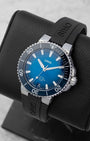 Angled shot of an Oris Aquis Date automatic watch highlighting the bold luminous baton markers and the security crown guards
