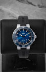 Oris Aquis Date Calibre 400 dive watch featuring a gradient blue sunray dial blue ceramic rotating bezel and a date window