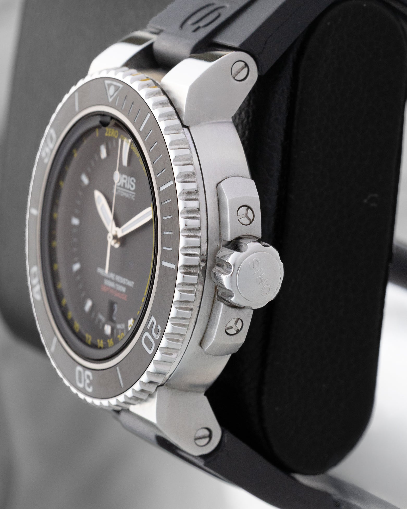 Right side profile view of the pre-owned Oris Aquis Depth Gauge 01 733 7675 4154 stainless steel case, crown guards, and screw-down winding crown.