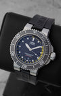 Angled perspective of a pre-owned Oris Aquis Depth Gauge 46mm dive watch showing the ceramic bezel, depth gauge sapphire crystal, and black rubber strap.