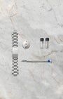 Additional stainless steel bracelet, strap changing tool, and cleaning accessories for the Oris Aquis Depth Gauge 01 733 7675 4154.
