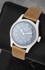 Three-quarter view of Oris Big Crown Pointer Date 4065 featuring a light blue dial, Arabic numerals, and red pointer date hand