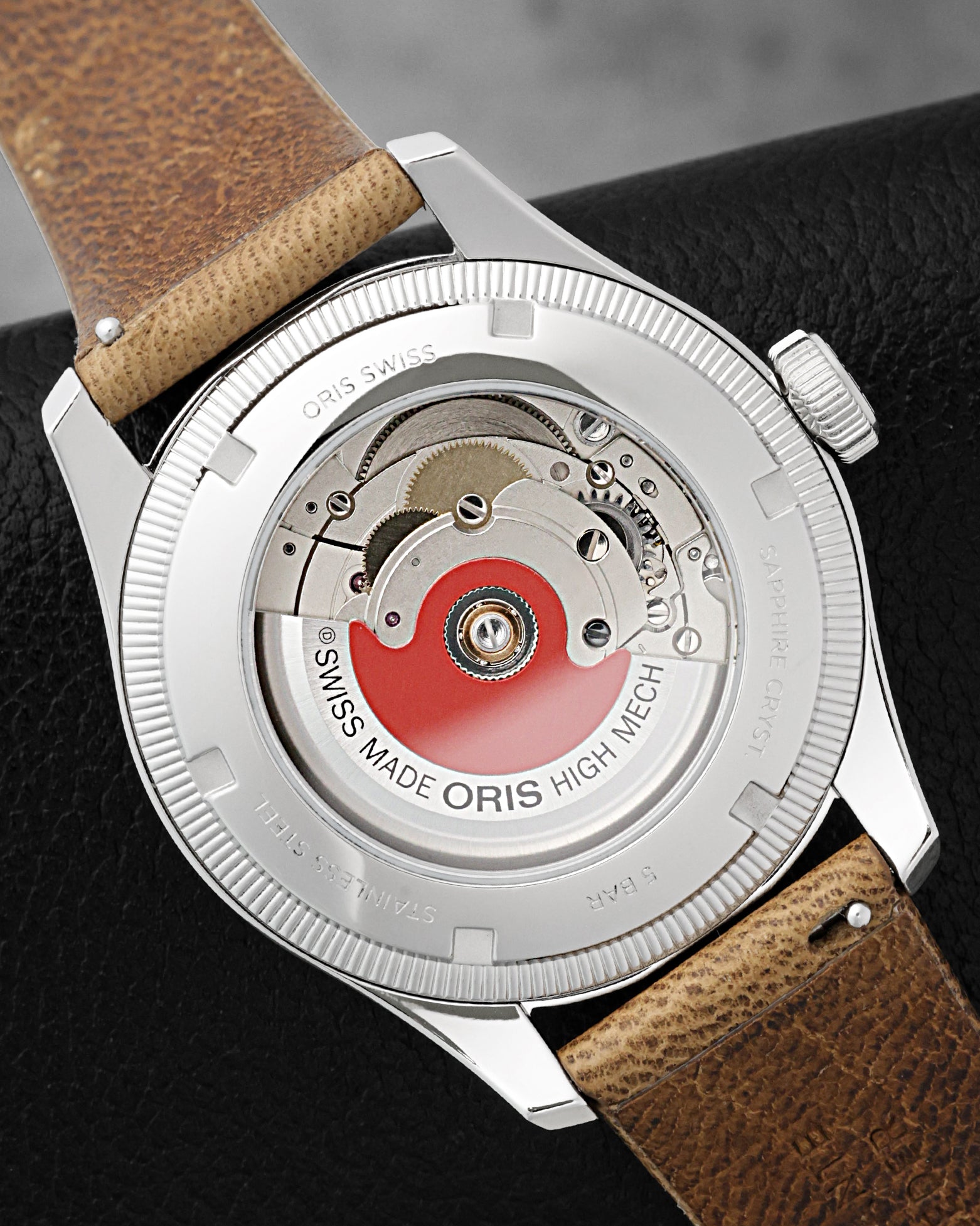 Exhibition sapphire case back displaying the Oris Calibre 754 automatic movement with signature red rotor