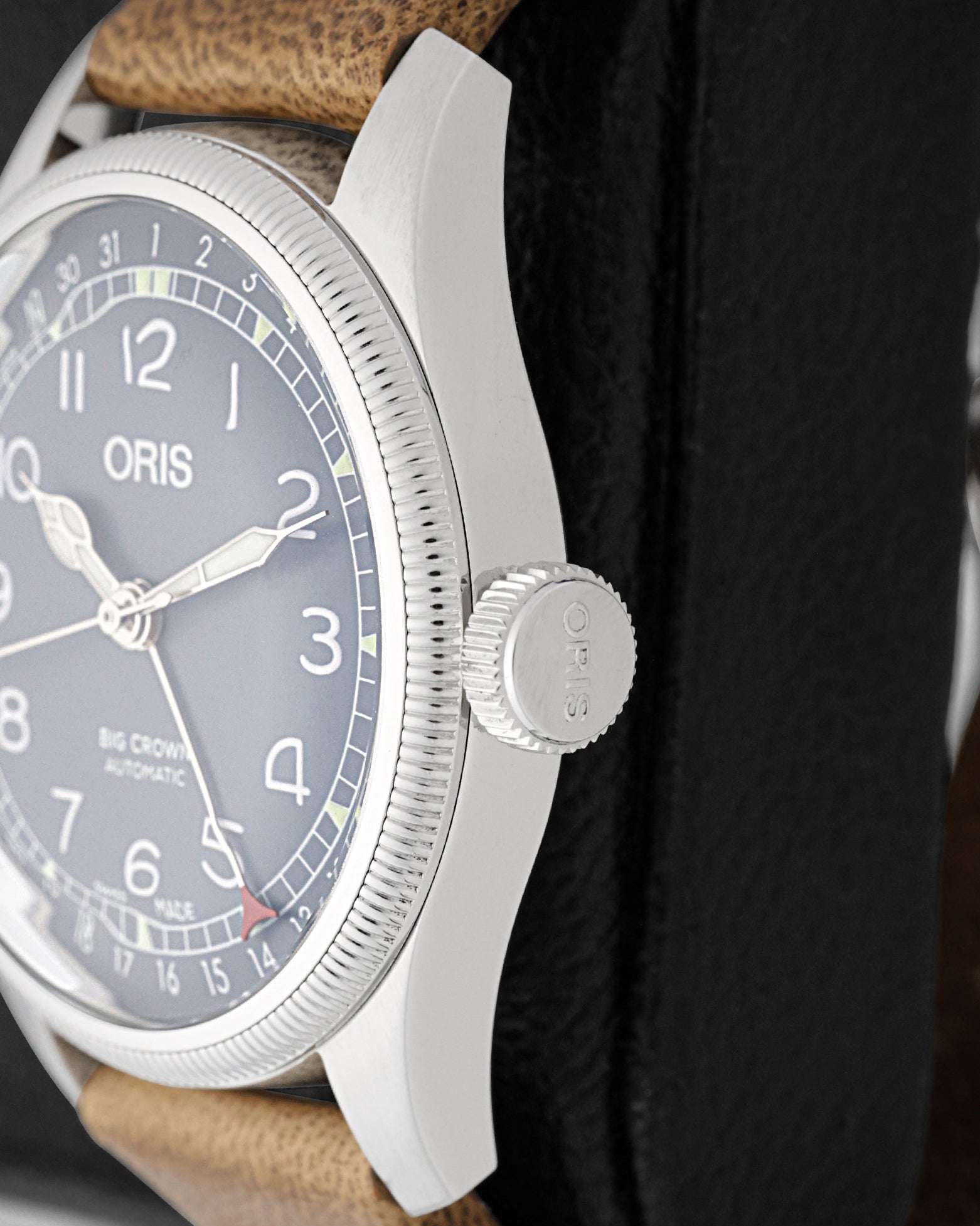 Close-up side view of the signature oversized screw-in crown and fluted coin-edge bezel on Oris Big Crown Pointer Date 4065