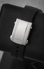 Rear perspective of the black rubber diving strap featuring the Oris text branding and the adjustable stainless steel security folding clasp