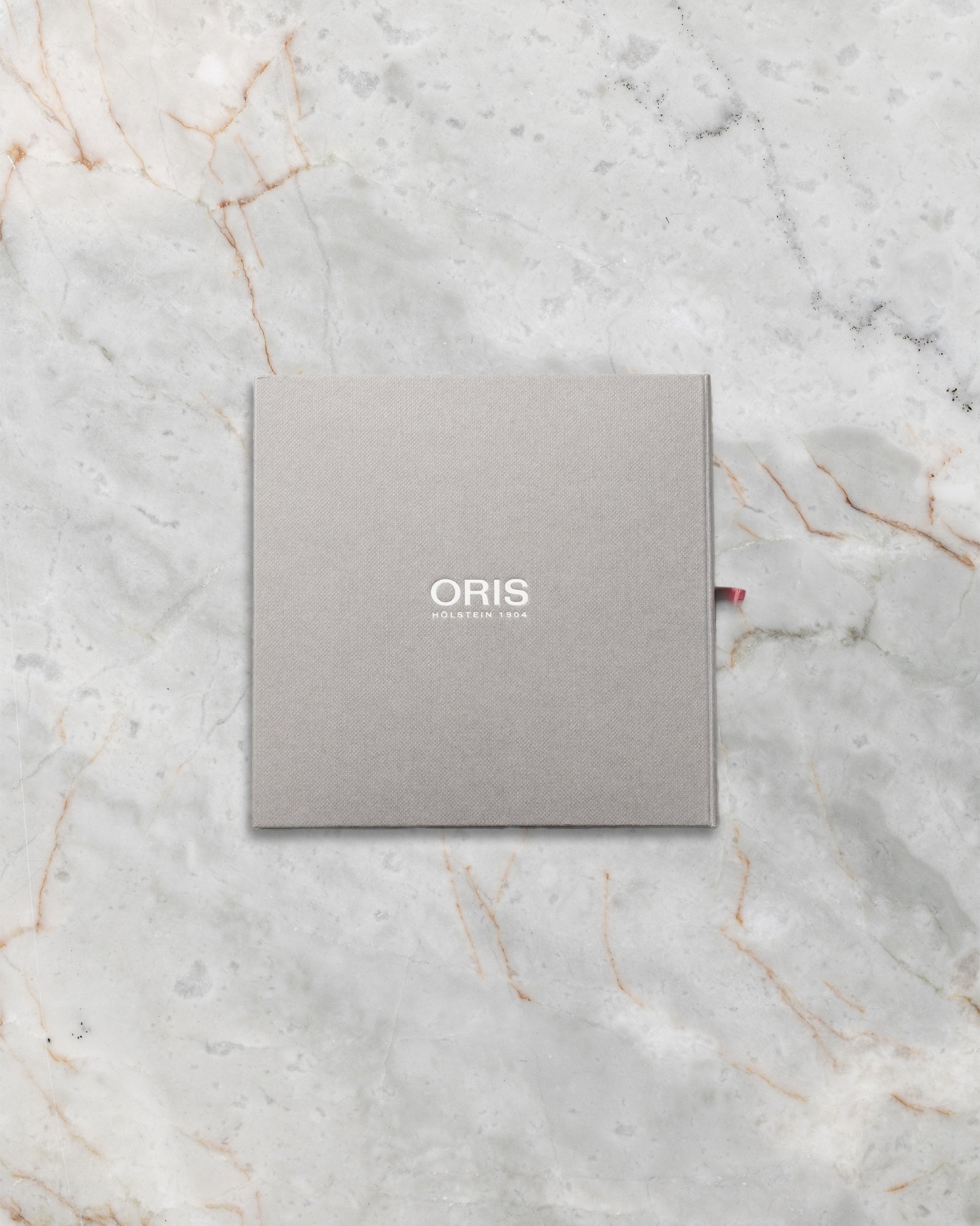 Official grey square Oris instructional manual and international service booklet package at Noahs Fine Watches and Jewelry Dallas