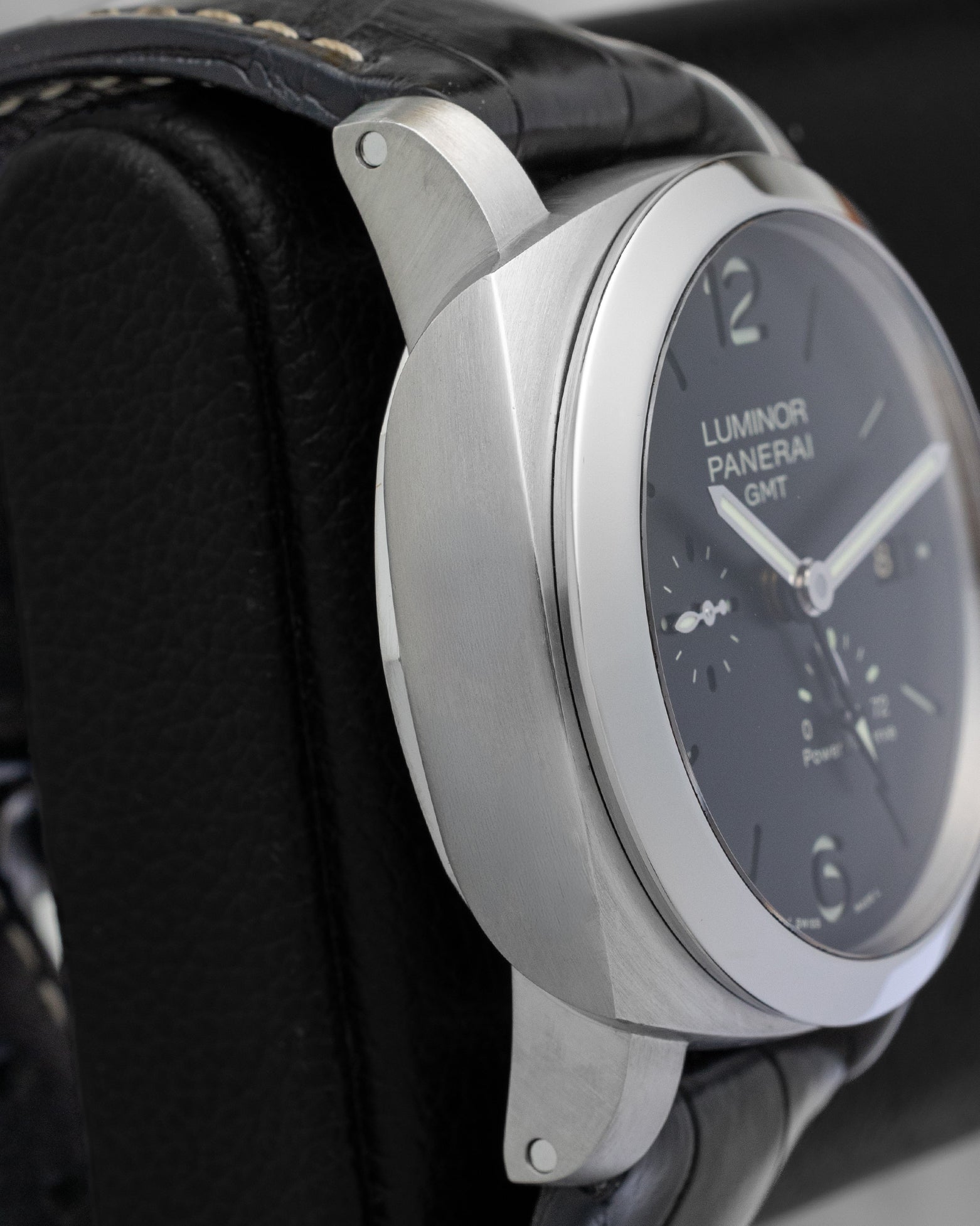 Left side profile view highlighting the satin-brushed 1950 style stainless steel case wall on a 2011 Panerai Luminor GMT PAM00321
