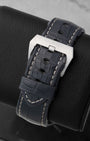 Back view showing the dark alligator leather strap with large brushed stainless steel trapezoid pin buckle on a Panerai PAM00321