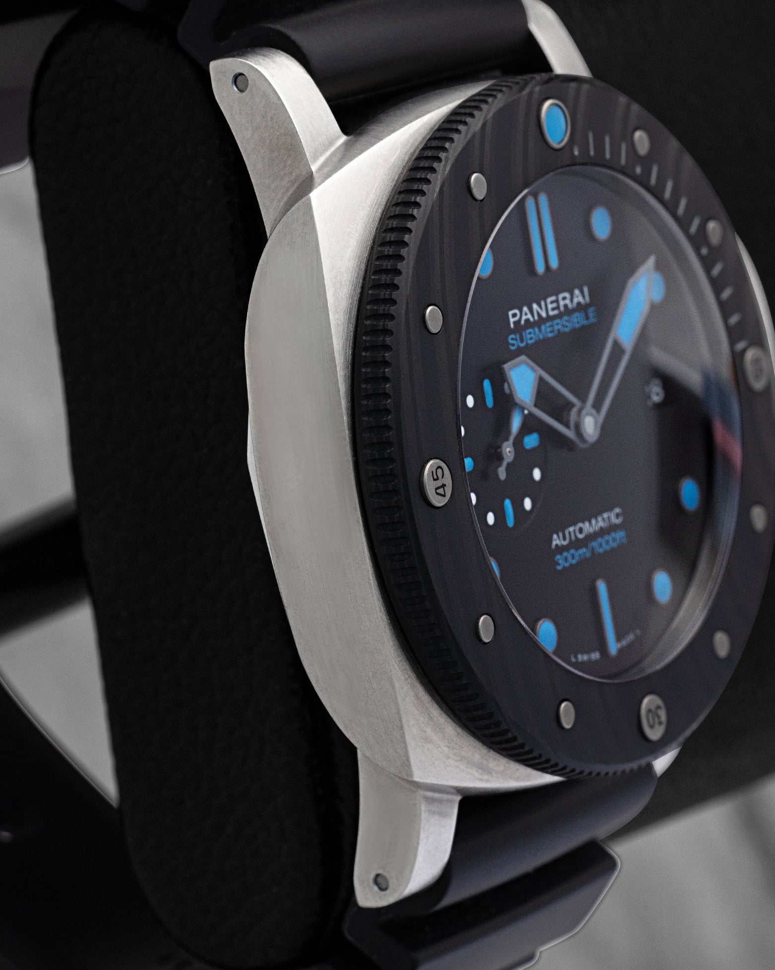 Side case profile showing the metallic glass sheen and Carbotech bezel edge on pre-owned Panerai Submersible 47mm