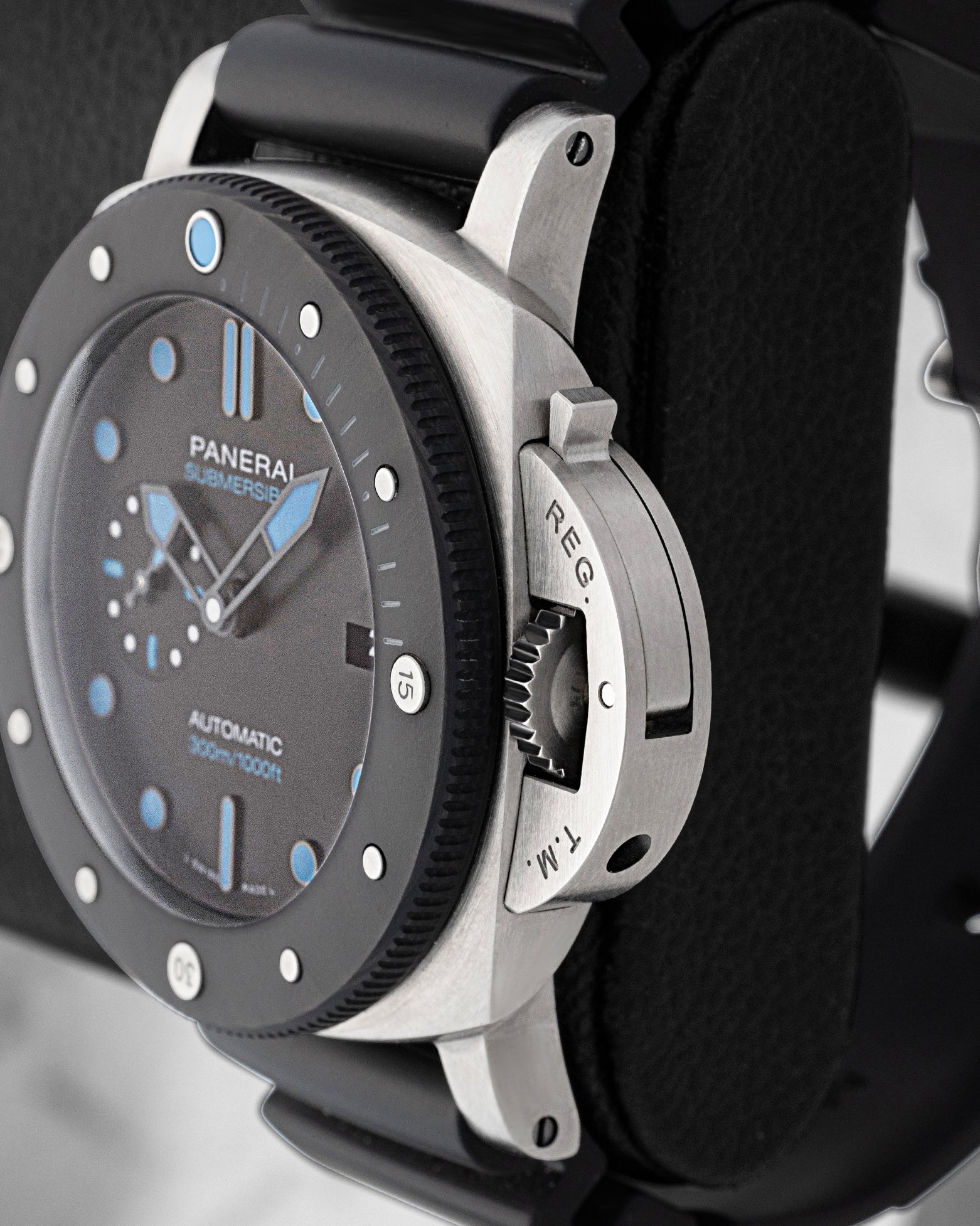 Side profile view of BMG-TECH bulk metallic glass case and iconic trademarked crown protection bridge on Panerai PAM00799