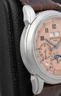 Left side view of the 41mm platinum case on the Patek Philippe 5270P-001, displaying the signature concave bezel and prominent stepped tier lugs