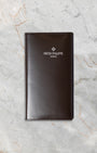 Official brown leather Patek Philippe document folder and certificate wallet included with the 2021 full set at Noah's Fine Watches and Jewelry Dallas