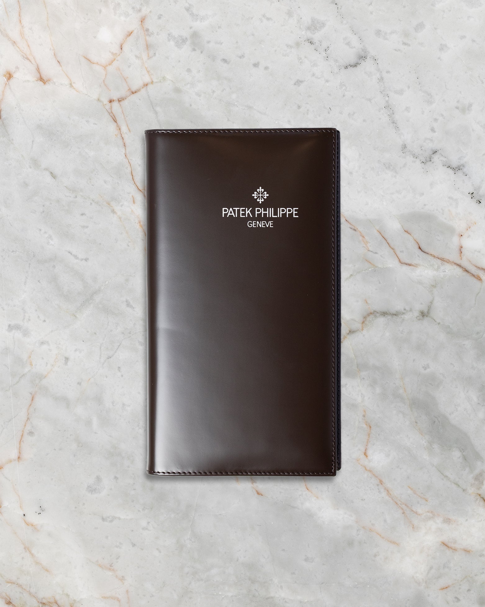 Official brown leather Patek Philippe document folder and certificate wallet included with the 2021 full set at Noah's Fine Watches and Jewelry Dallas