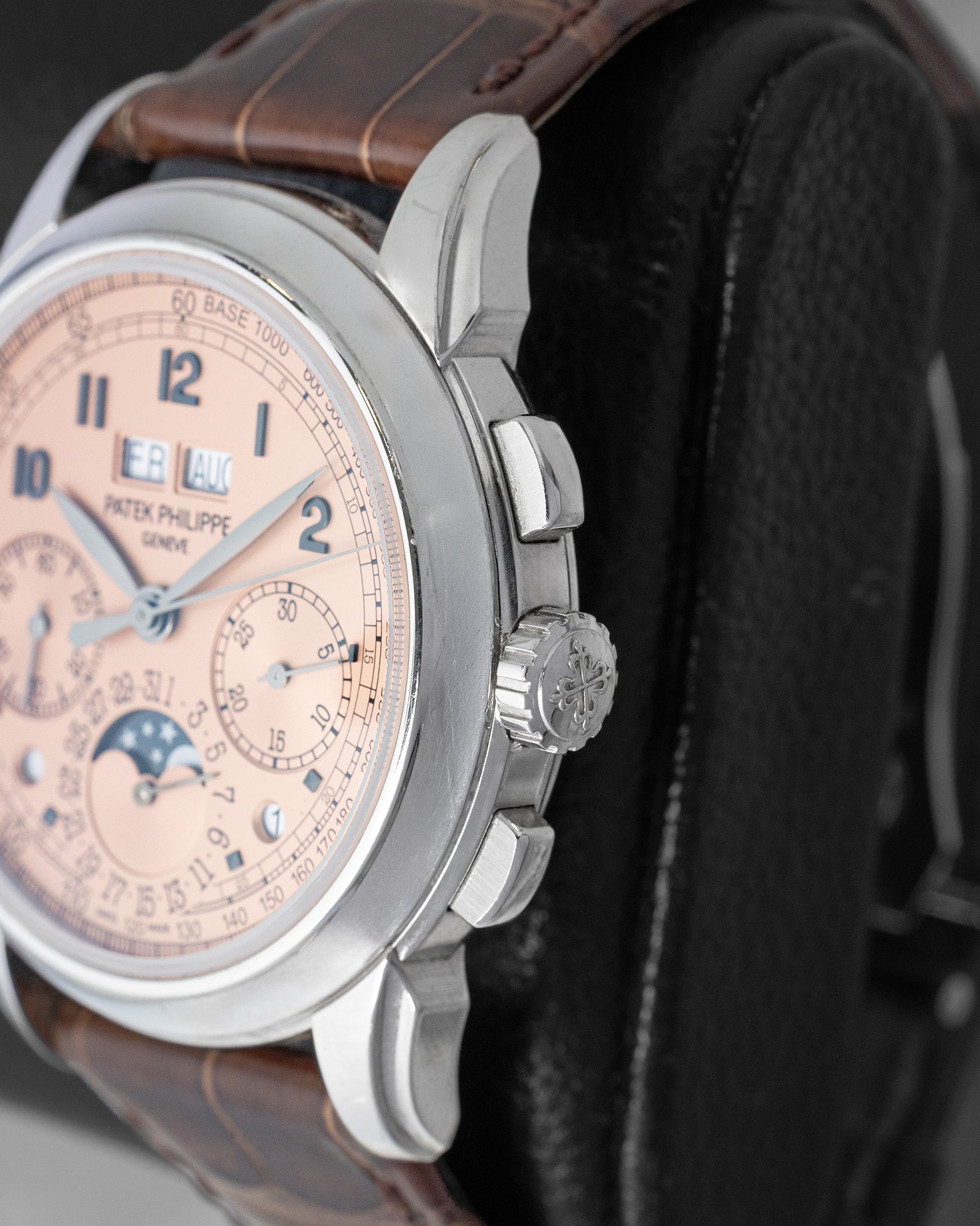Close-up side profile of the Patek Philippe Grand Complications 5270P highlighting the polished platinum crown, rectangular chronograph pushers, and correction buttons