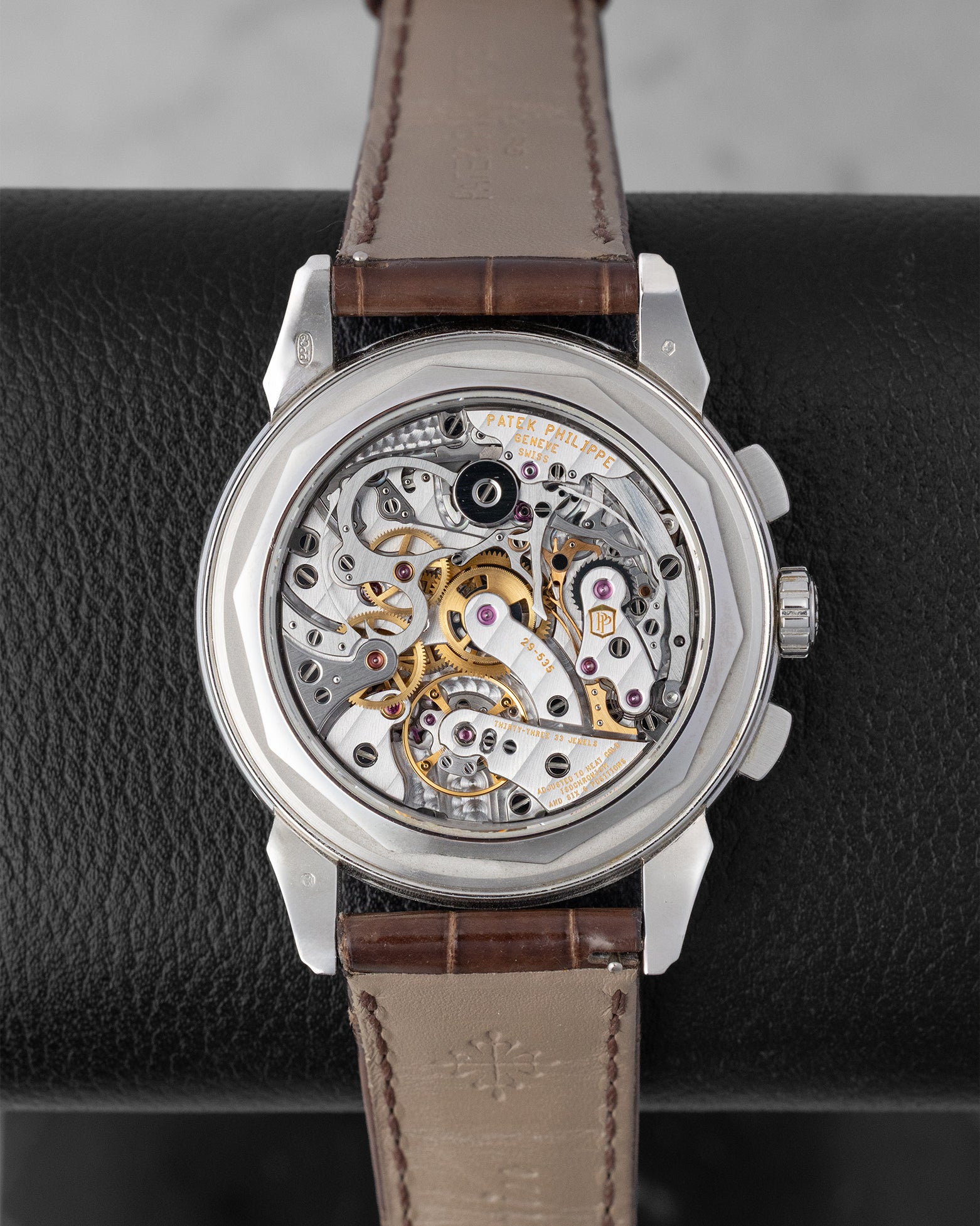 The interchangeable sapphire crystal caseback revealing the intricate manual-winding Caliber CH 29-535 PS Q perpetual calendar chronograph movement