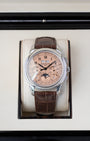 A 2021 pre-owned Patek Philippe Grand Complications 5270P-001 platinum watch safely housed inside its original gloss-finished wooden presentation box