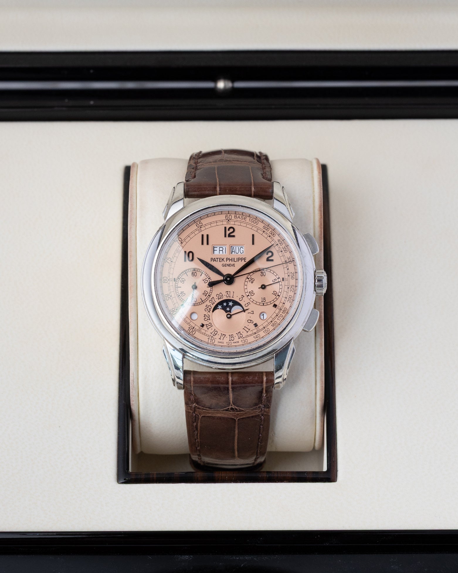 A 2021 pre-owned Patek Philippe Grand Complications 5270P-001 platinum watch safely housed inside its original gloss-finished wooden presentation box