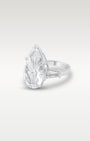 Three-quarter angle view showing the band detail and tapered baguette side stones on a platinum pear-cut diamond ring