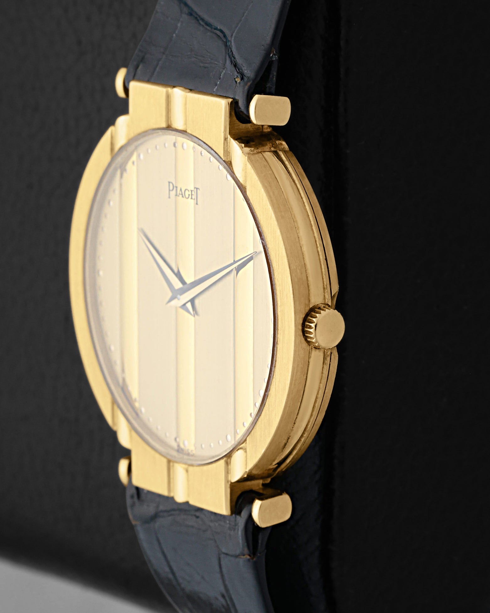 Side profile view highlighting the ultra-thin 18k yellow gold case design and integrated crown of a vintage Piaget Polo