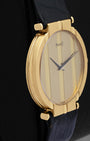 Left side view showcasing the polished 18k yellow gold case steps and smooth bezel finish on a classic Piaget Polo watch