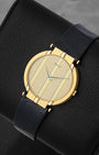 Front angled view of an 18k yellow gold vintage Piaget Polo quartz watch on display in Dallas