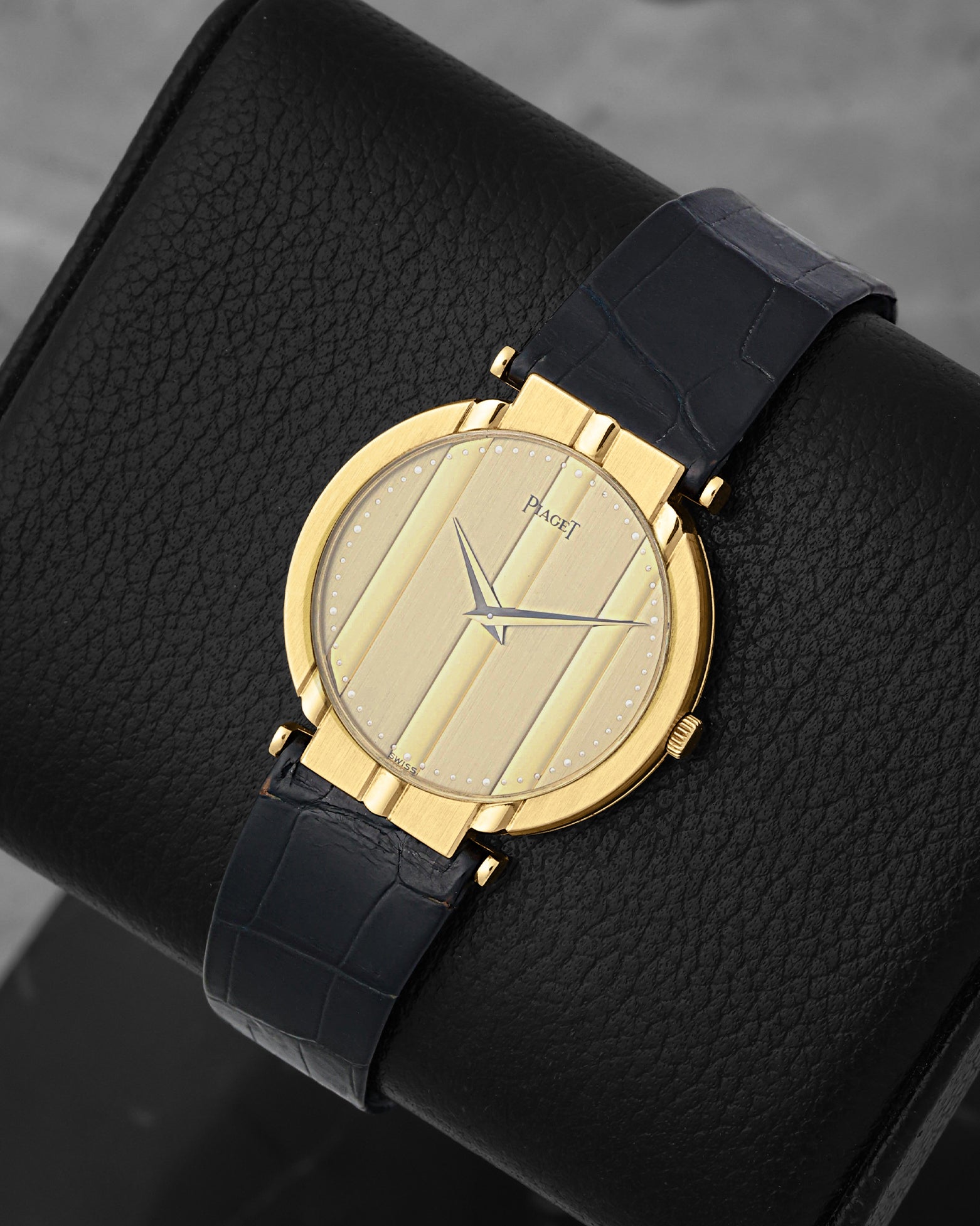 Front angled view of an 18k yellow gold vintage Piaget Polo quartz watch on display in Dallas