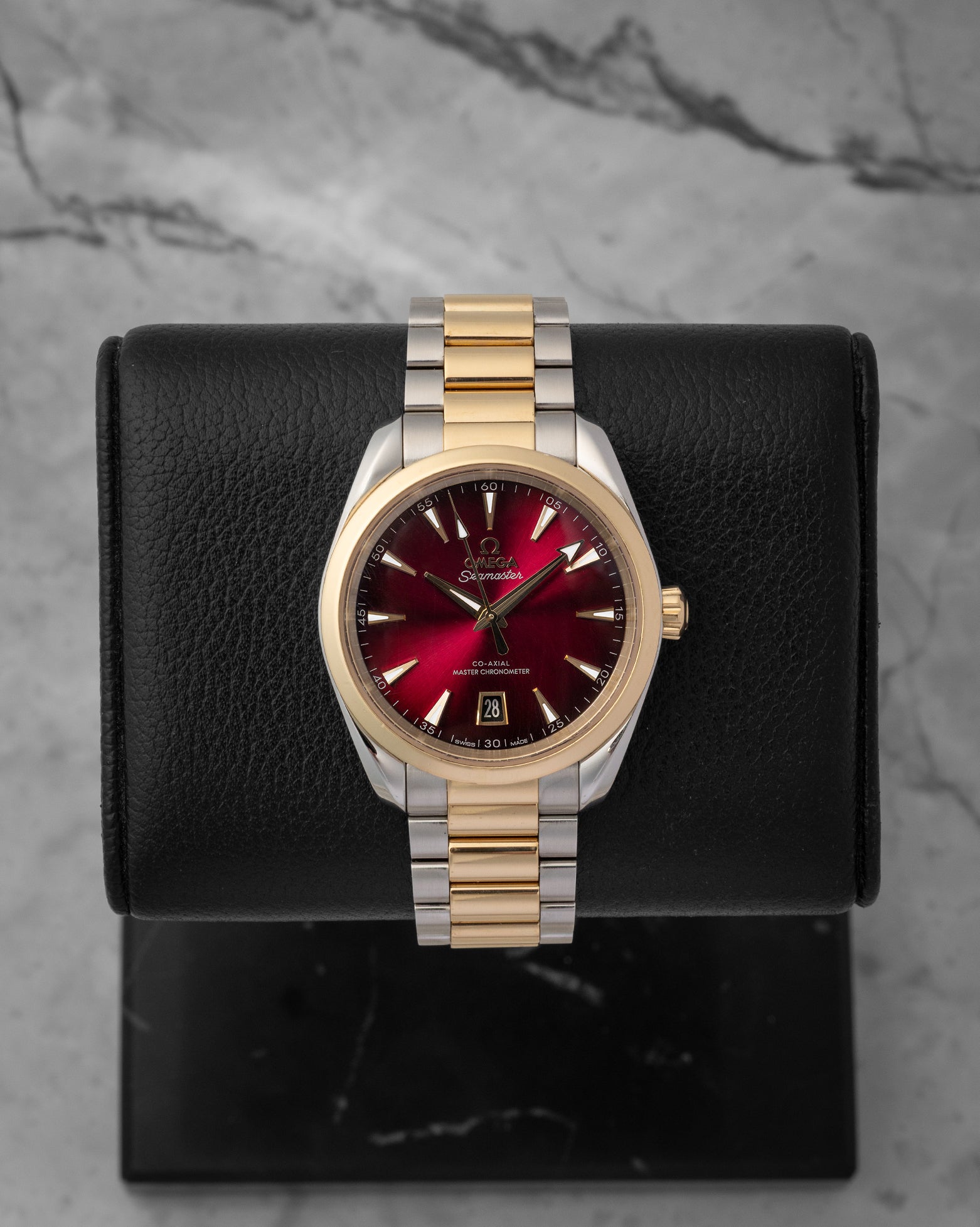A preowned 2025 Omega Seamaster Aqua Terra 150M reference 220.20.38.20.10.002 displaying its sun-brushed burgundy lacquer dial and 18k Moonshine Gold accents at Noah's Fine Watches & Jewelry in Dallas