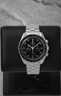 A preowned 2025 Omega Speedmaster Professional Moonwatch reference 310.30.42.50.01.002 featuring a matte black step dial, tri-compax chronograph layout, and sapphire crystal at Noah's Fine Watches & Jewelry in Dallas