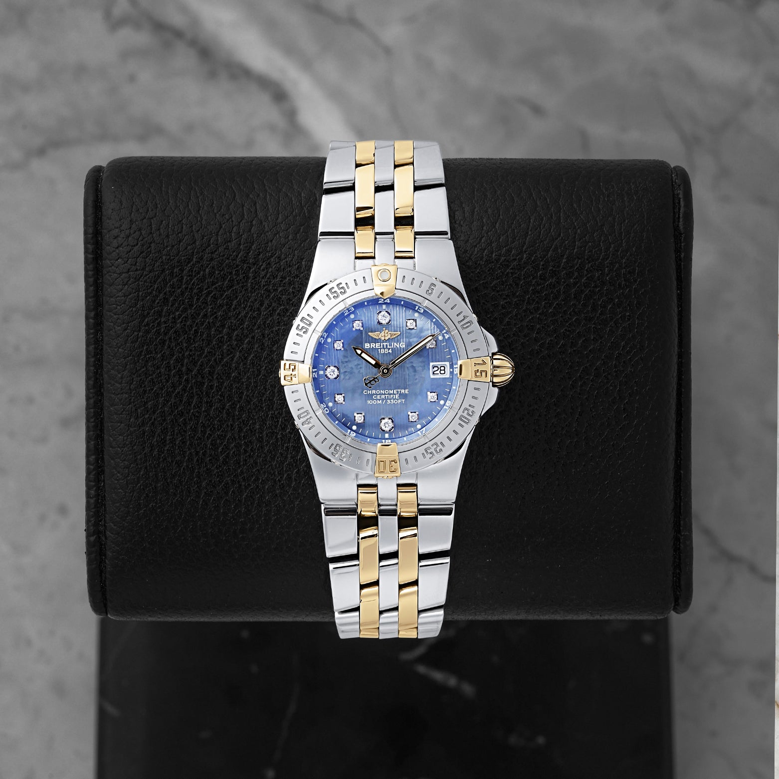 Preowned Breitling Starliner 30mm B71340 ladies two-tone steel and yellow gold watch with factory diamond hour markers and blue Mother of Pearl dial at Noah's Fine Watches and Jewelry Dallas Texas