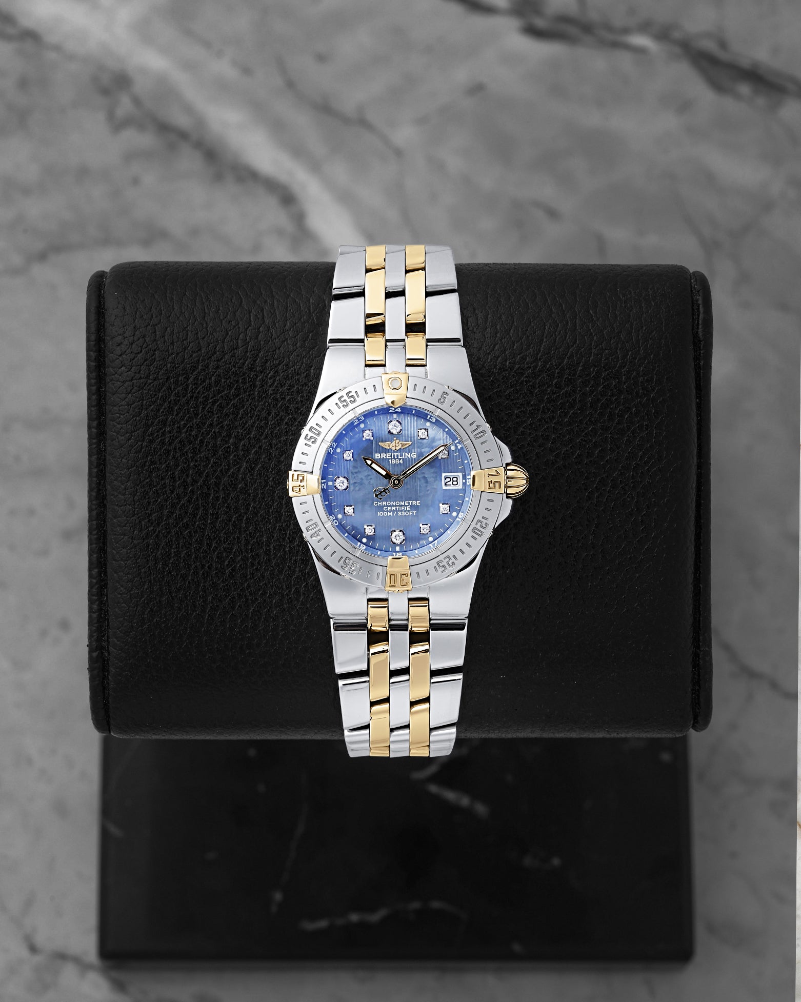 Preowned Breitling Starliner 30mm B71340 ladies two-tone steel and yellow gold watch with factory diamond hour markers and blue Mother of Pearl dial at Noah's Fine Watches and Jewelry Dallas Texas