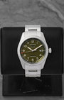 A preowned Longines Spirit 42mm reference L3.811.4.03.6 featuring a matte olive green pilot dial, sandblasted Arabic numerals, and a silver five-star quality crest at Noah's Fine Watches & Jewelry in Dallas
