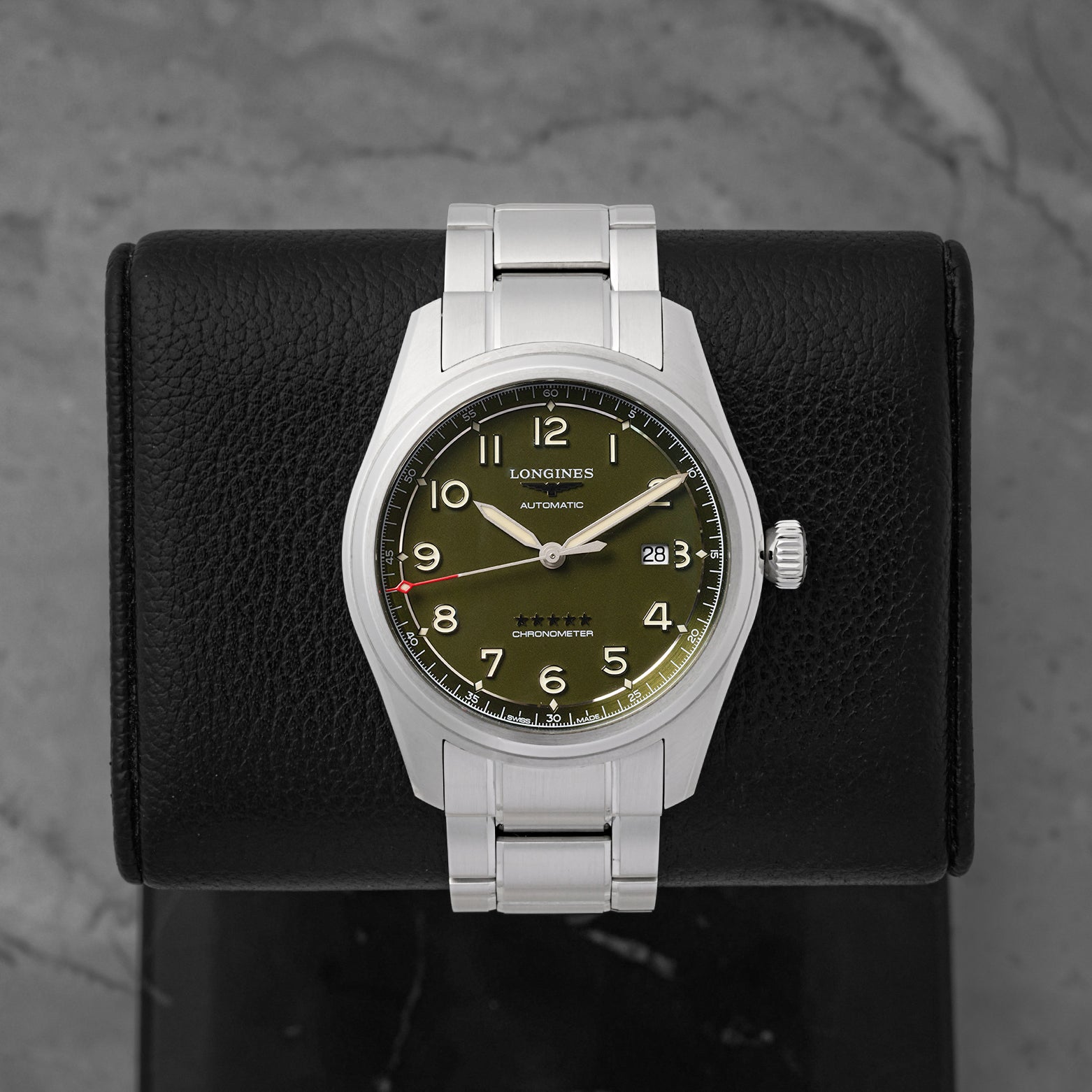 A preowned Longines Spirit 42mm reference L3.811.4.03.6 featuring a matte olive green pilot dial, sandblasted Arabic numerals, and a silver five-star quality crest at Noah's Fine Watches & Jewelry in Dallas