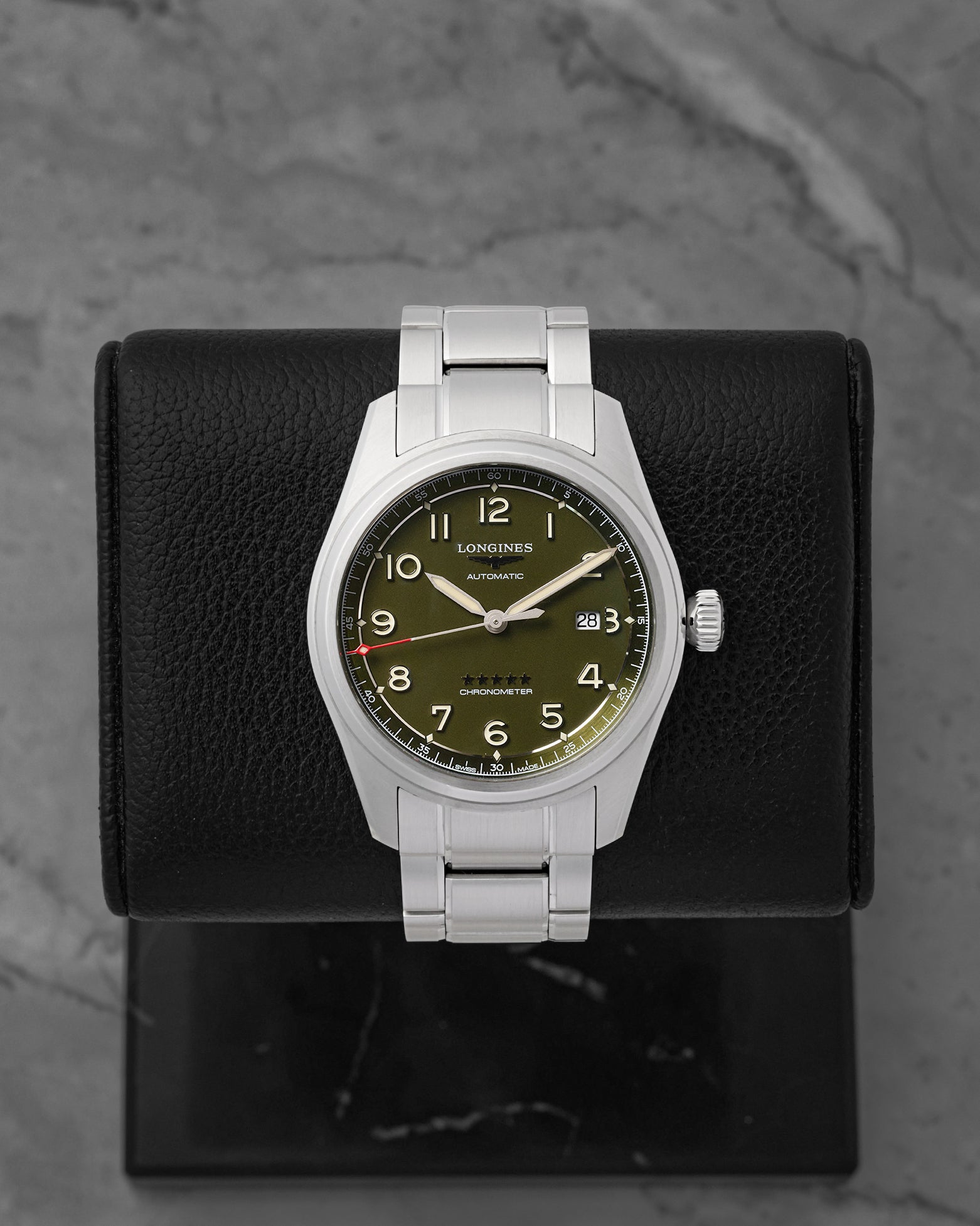 A preowned Longines Spirit 42mm reference L3.811.4.03.6 featuring a matte olive green pilot dial, sandblasted Arabic numerals, and a silver five-star quality crest at Noah's Fine Watches & Jewelry in Dallas