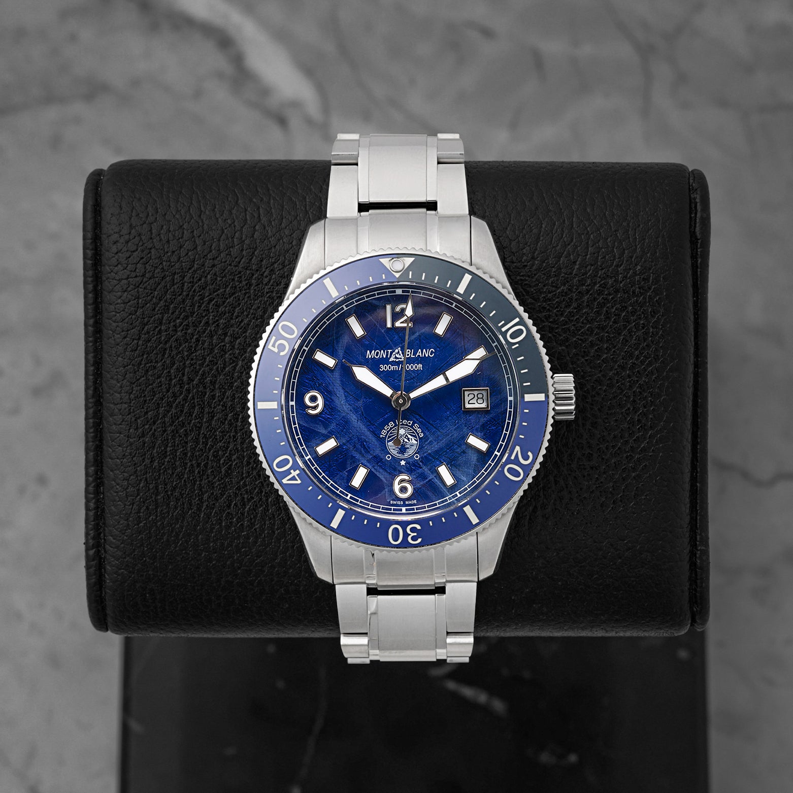 A pre-owned Montblanc 1858 Iced Sea Automatic Date reference MB131325 featuring its signature blue glacier pattern dial, matching blue ceramic dive bezel, and cathedral hands at Noah's Fine Watches & Jewelry in Dallas