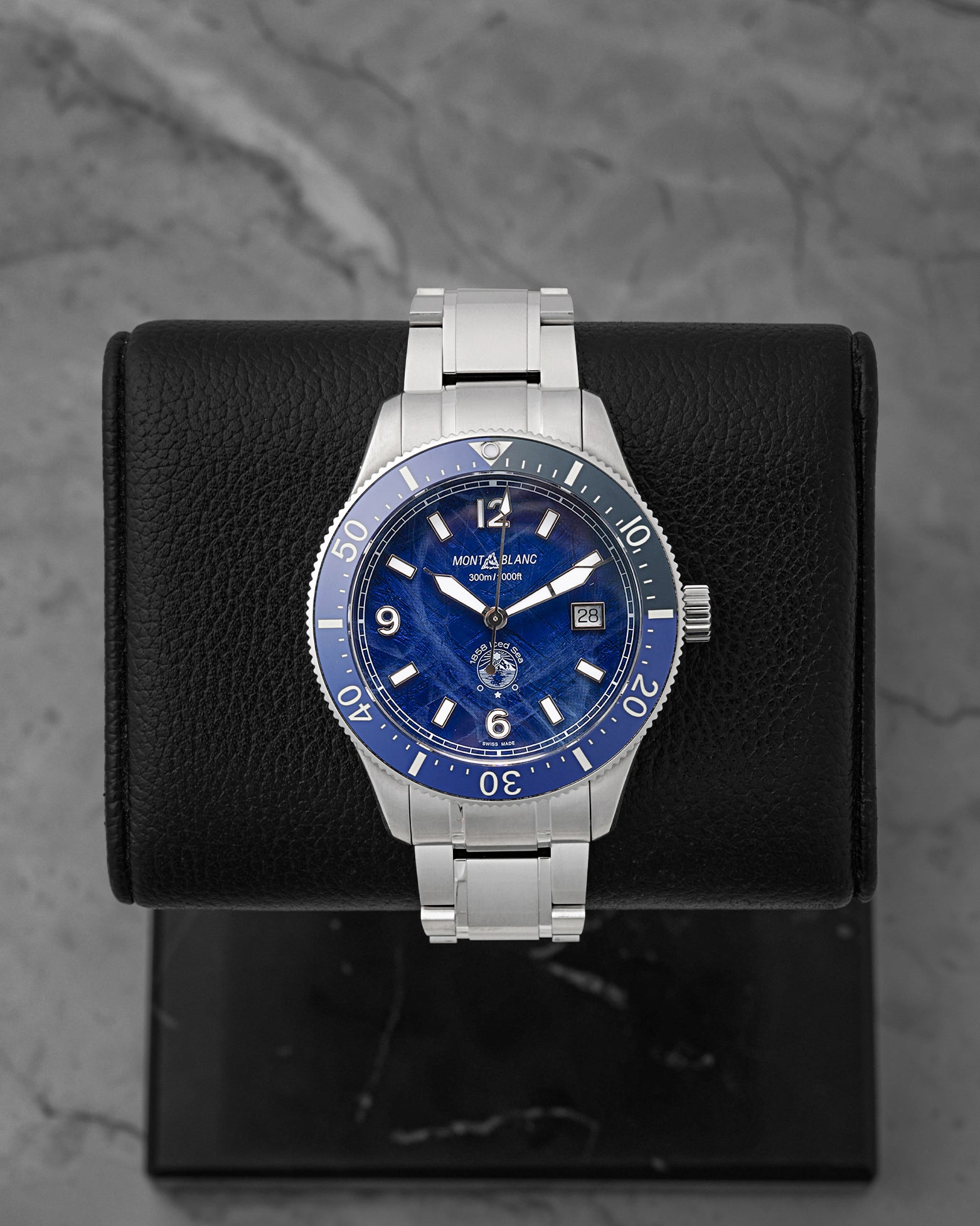 A pre-owned Montblanc 1858 Iced Sea Automatic Date reference MB131325 featuring its signature blue glacier pattern dial, matching blue ceramic dive bezel, and cathedral hands at Noah's Fine Watches & Jewelry in Dallas