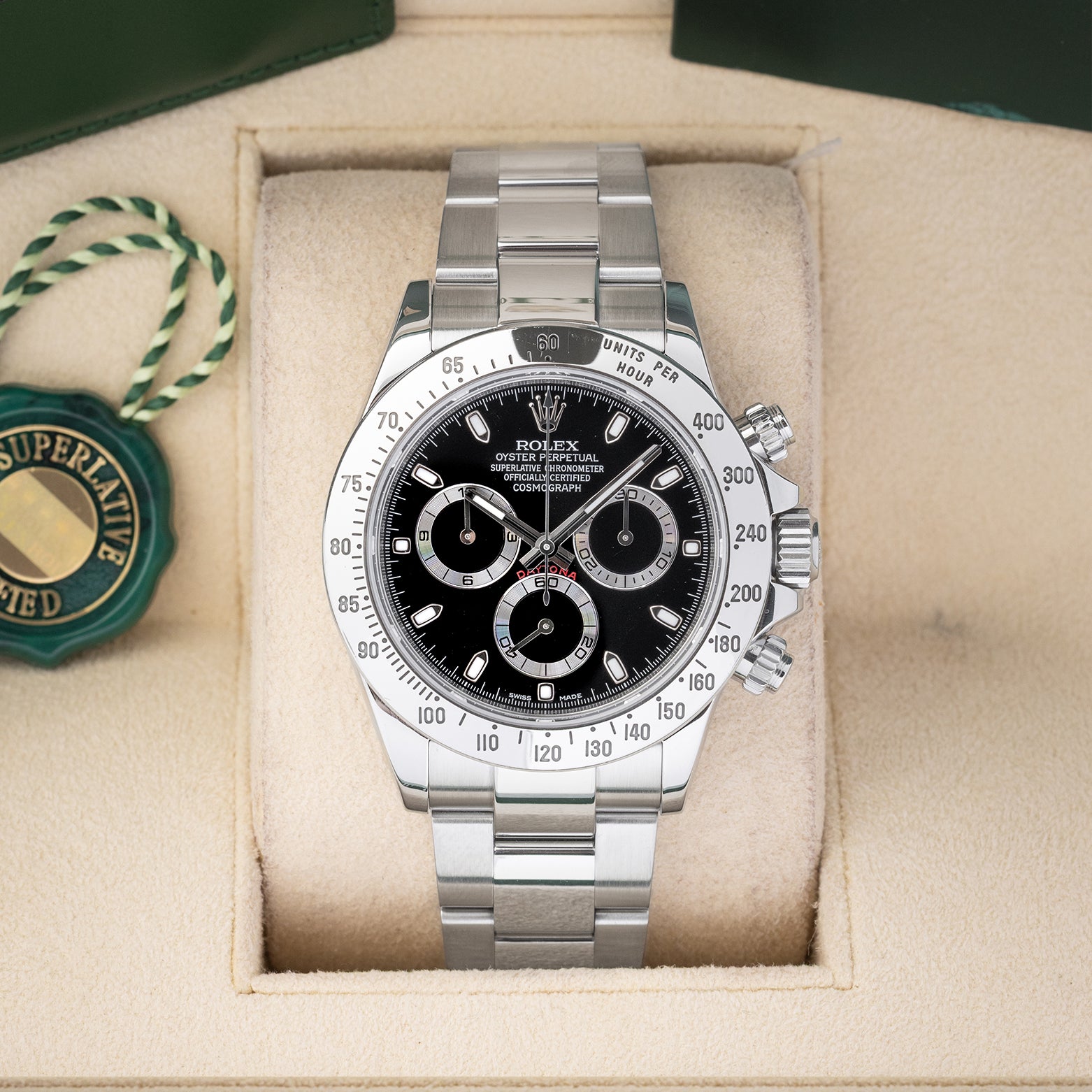Preowned Rolex Cosmograph Daytona 116520 stainless steel watch with black dial and steel tachymeter bezel at Noah's Fine Watches and Jewelry Dallas Texas