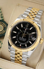 angled view of the 42mm Rolex Sky-Dweller 326933 showing the dual time zone off-center disc, Saros annual calendar, and 18k yellow gold Ring Command bezel