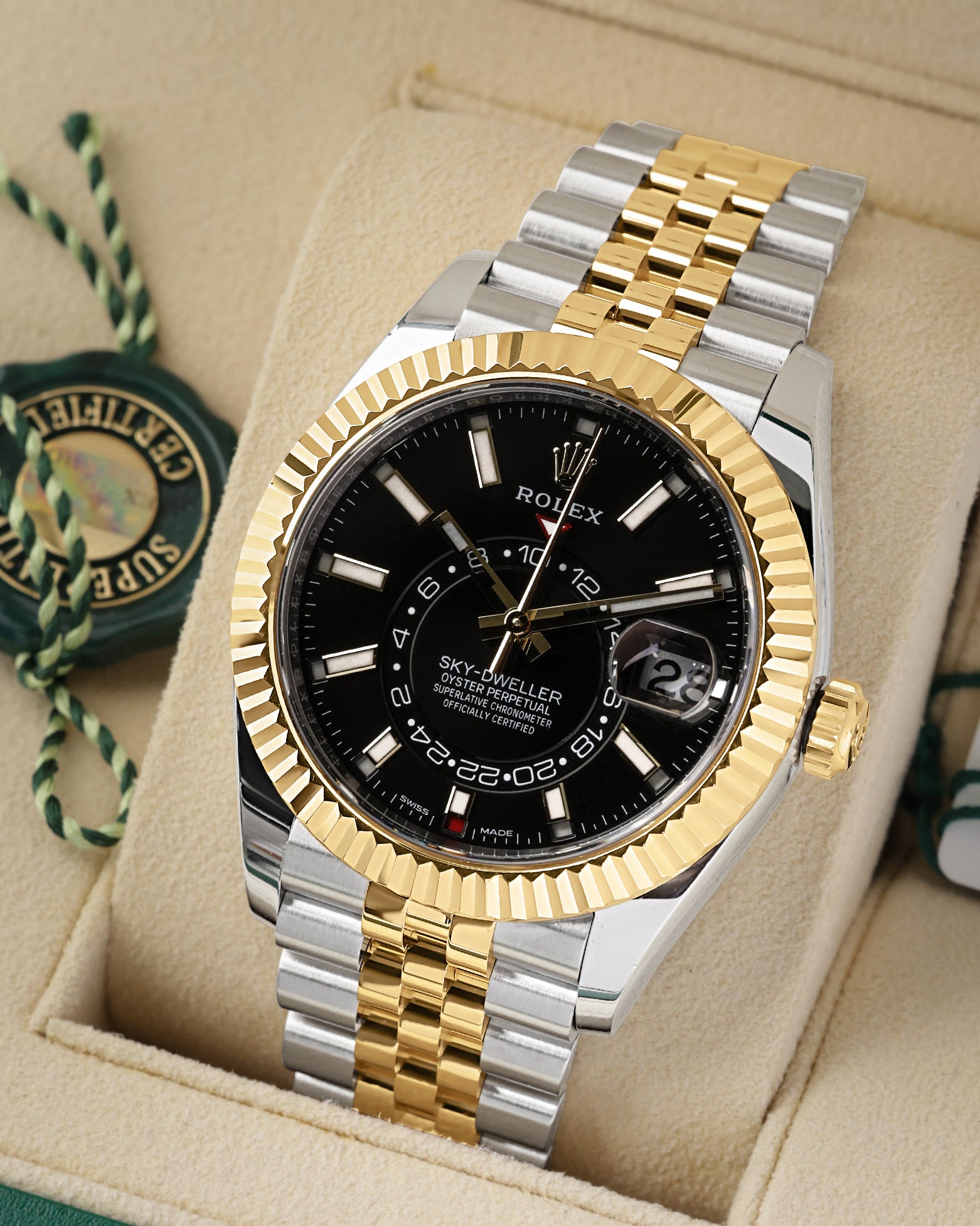 angled view of the 42mm Rolex Sky-Dweller 326933 showing the dual time zone off-center disc, Saros annual calendar, and 18k yellow gold Ring Command bezel