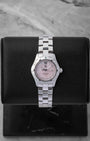 Preowned TAG Heuer Aquaracer 27mm WAF141A.BA0824 ladies stainless steel luxury watch featuring a pink Mother of Pearl dial and 10 diamond hour markers at Noah's Fine Watches and Jewelry in Dallas
