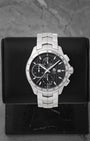 A pre owned TAG Heuer Link Calibre 16 automatic chronograph reference CAT2013 featuring a black dial with vertical textured pinstripes and triple sub-registers at Noah's Fine Watches & Jewelry in Dallas