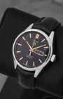 A high-angle three-quarter view of the 41mm stainless steel Carrera case highlighting its polished fixed bezel and faceted rose gold indices on a black leather cushion