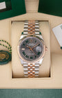 A preowned 2023 Rolex Datejust 36 reference 126231 in two-tone Everose Rolesor featuring a slate Wimbledon dial with green-outlined Roman numeral markers inside its box at Noah's Fine Watches & Jewelry in Dallas