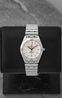 A ladies' pre-owned 2025 Breitling Chronomat 32 reference A77310 featuring a silver sunburst dial, luminous rose gold baton hour markers, and a date window at 6 o'clock at Noah's Fine Watches & Jewelry in Dallas