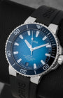 angled view of the 43.5mm stainless steel Oris Aquis dive watch showcasing its polished blue ceramic unidirectional rotating scratch-resistant bezel