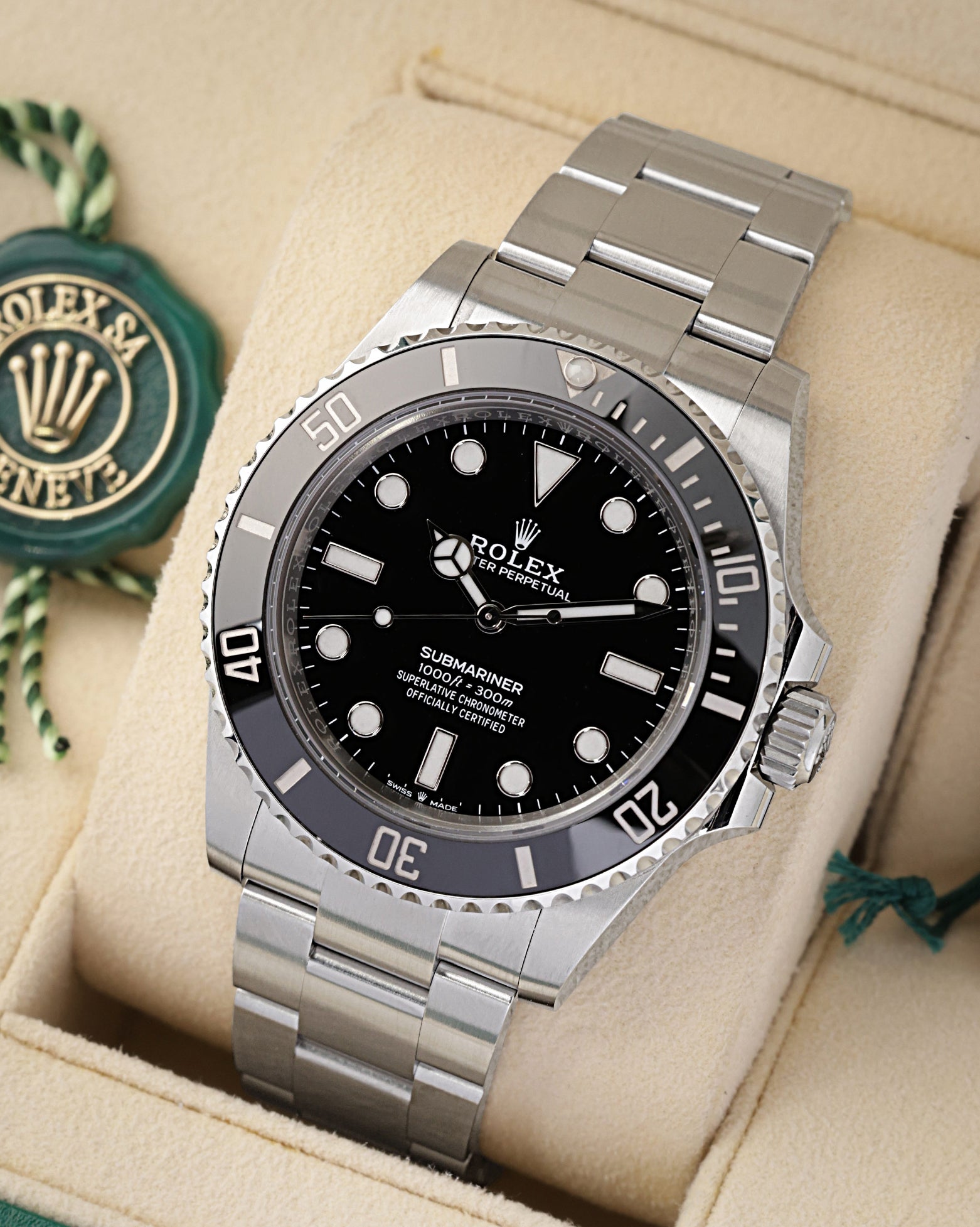 Angled view of the 41mm Oystersteel case, glossy black dial, and unidirectional Cerachrom ceramic dive bezel on a Rolex Submariner 124060